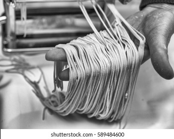 Woman Chef Making Simple Homemade Noodles With Pasta Machine