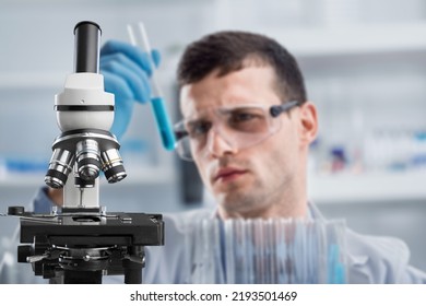 Woman Chemist Holds Flask With Liquid In Hands In The Chemical Laboratory. Quality Control Of Petrochemical Products Concept.