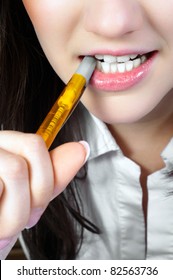 Woman Chewing On A Pencil