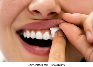 Woman Chewing Wet Moist Nicotine Tobacco Snus Product - Shutterstock ID 2009313140