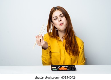 A Woman Chews Food