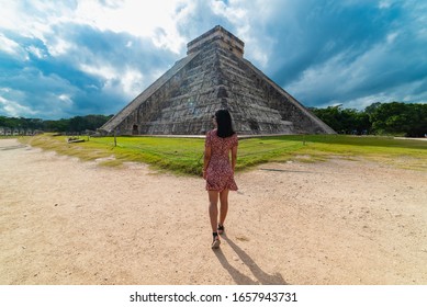 Woman with Chichen Itza Mayan Ruins in the background Yucatan Mexico