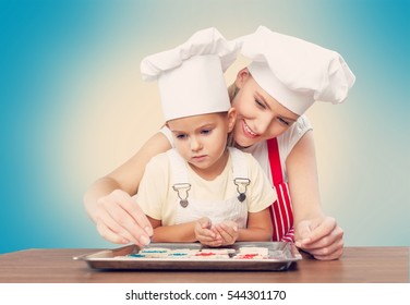 Woman And Child Coocking.