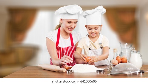 Woman And Child Coocking.