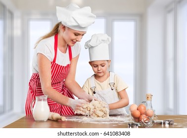 Woman And Child Coocking.