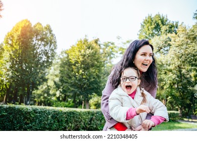 Woman And Child Enjoy Walk Autumn Sunny Day Outside. Happy Family Moments Concept. Lovely Child In Eyeglasses With Cute Facial Expression.