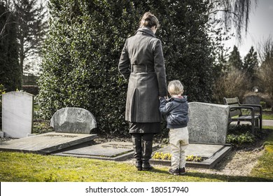 Woman with child at graveyard