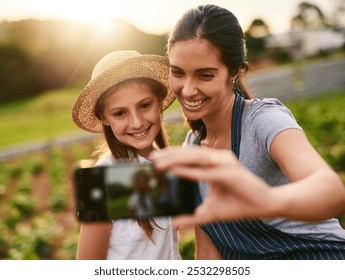 Woman, child and happy on farm for selfie, social media post and agriculture. Family business, mother and daughter with smile for photography, website update and connectivity in Colombia countryside - Powered by Shutterstock