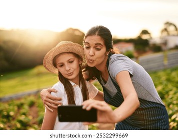 Woman, child and hug on farm for selfie, social media post and agriculture. Family business, mother and daughter with pout for photography, website update and connectivity in Colombia countryside - Powered by Shutterstock