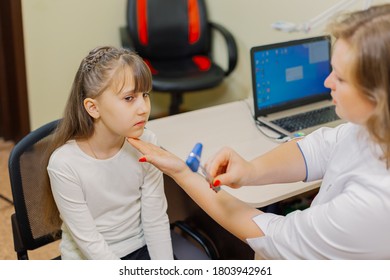 Woman Child Neurologist Examines The Girl In The Office.