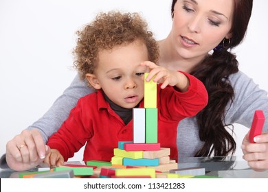 Woman And Child Playing With Building Blocks