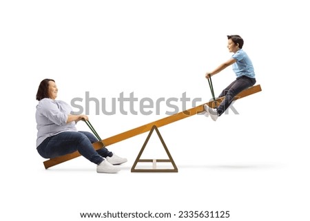 Woman and a child playing on a seesaw isolated on white background