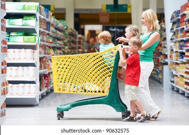 Woman And Children With Shopping Cart In Supermarket Store Warwehouse