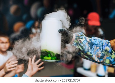 Woman children's animator conducts chemical experiment, experience, show with colored liquid in glass flask with smoke reaction for children. Photo, concept of technology in chemistry. - Powered by Shutterstock