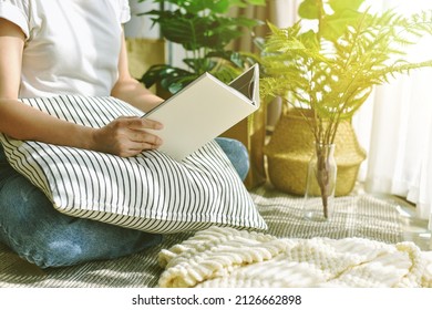 Woman Chilling And Reading In Living Room, Artificial Plant, Fiddle Leaf Fig Tree, Indoor Tropical Natural Houseplant For Home Interior And Air Purification.