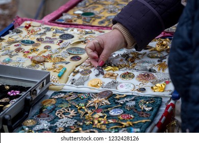 Woman Choose The Antique Brooch At Flea Market