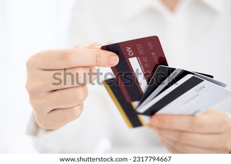 woman choose one credit card from many, concept of credit card debt,
