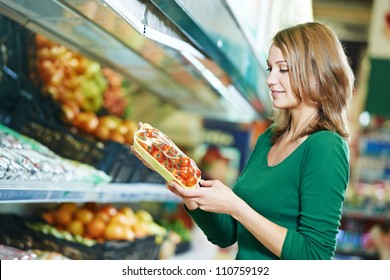 Woman Choosing Apple During Shopping At Fruit Vegetable Supermarket