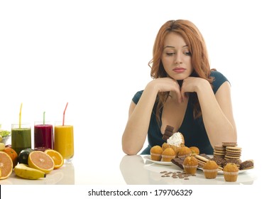 Woman choosing between fruits, smoothie and organic healthy food against sweets, sugar, lots of candies, unhealthy food