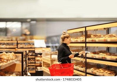 Woman choosing bread from a supermarket	
 - Powered by Shutterstock