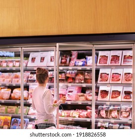 Woman choosing a dairy products at supermarket	 - Powered by Shutterstock