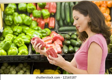 Woman Choosing Fresh Produce In Supermarket