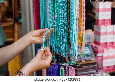 woman choosing jewelry at an oriental bazaar