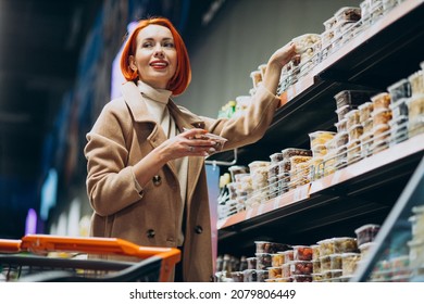 Woman Choosing Products At Super Market