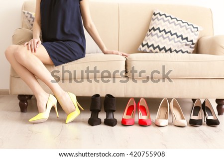 Woman choosing right shoes.