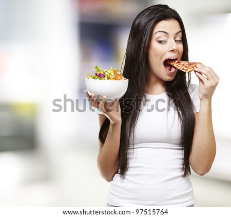 woman choosing a slice of pizza instead of a salad, indoor