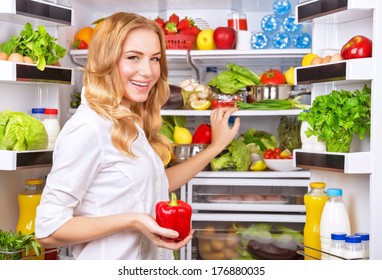 Woman Chosen Milk In Opened Refrigerator, Cool New Fridge Full Of Tasty Organic Nutrition, Female Preparing To Cook, Healthy Eating Concept