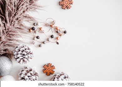 Woman Christmas Background On White. Frosty Pine Cones, Silver Colored Decoration Balls, Faux Fur, Jewelry. Copyspace For Text, Overhead, Horizontal