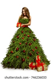 Woman Christmas Tree Dress And Present Gift, Fashion Model In New Year Gown Isolated Over White Background