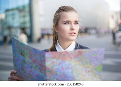 Woman With City Map Lost In Big City