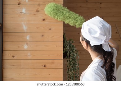 Woman Cleaner Cleaning Living Room In Apartment. Back Side Portrait Of Asian Woman Cleaning Staff Doing Housekeeping Or Domestic Helper Job. Young Adult Asian Woman Model