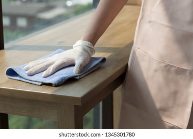 Woman Cleaner Cleaning Living Room In Apartment. Portrait Of Asian Woman Cleaning Staff Doing Housekeeping Or Domestic Helper Job. Young Adult Asian Woman Model