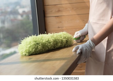 Woman Cleaner Cleaning Living Room In Apartment. Portrait Of Asian Woman Cleaning Staff Doing Housekeeping Or Domestic Helper Job. Young Adult Asian Woman Model