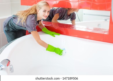 Woman Cleaning Bath At Home. Female Washing Bathtub. Tub