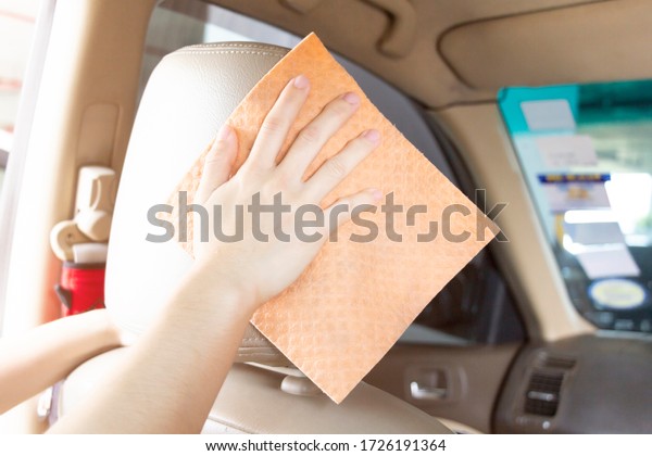 woman is cleaning car\
for protect virus.