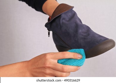 Woman Cleaning Chamois Leather Shoes. Suede Shoes Winter Care