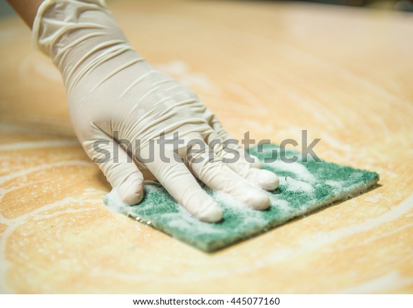 Woman cleaning the\
counter