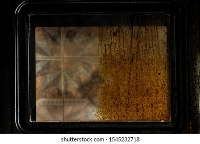 Woman Cleaning Dirty And Greasy Oven With Stove In Kitchen.