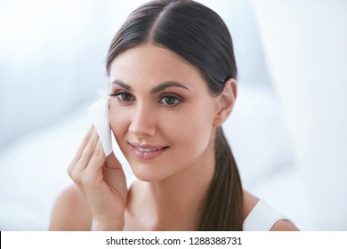 Woman Cleaning Face With Facial Cleansing Wipes, Removing Makeup