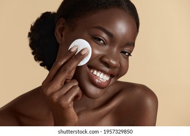 Woman Cleaning Face With White Pad. Beautiful Black Girl Removing Makeup White Cosmetic Cotton Pad. Happy Female Taking Off Makeup From Facial Skin With Cosmetic Pad. Hight Quality Image