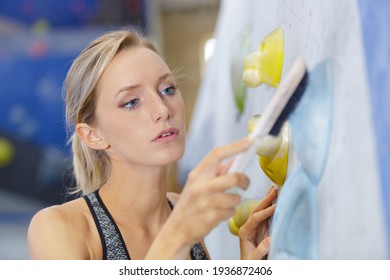 Woman Cleaning In A Fitness Center