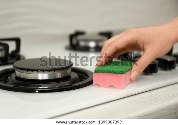 Woman Cleaning Gas Stove Sponge Closeup Stock Photo Edit Now