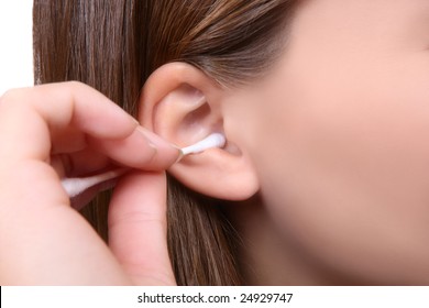 A Woman Cleaning Her Ear With Cotton Swab