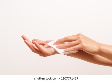 Woman Cleaning Her Hands With White Soft Tissue Paper. Isolated On A White Backgrounds