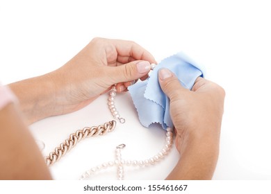 Woman Cleaning A Jewellery With A Special Cloth