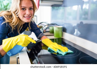 Woman Cleaning Up In The Kitchen